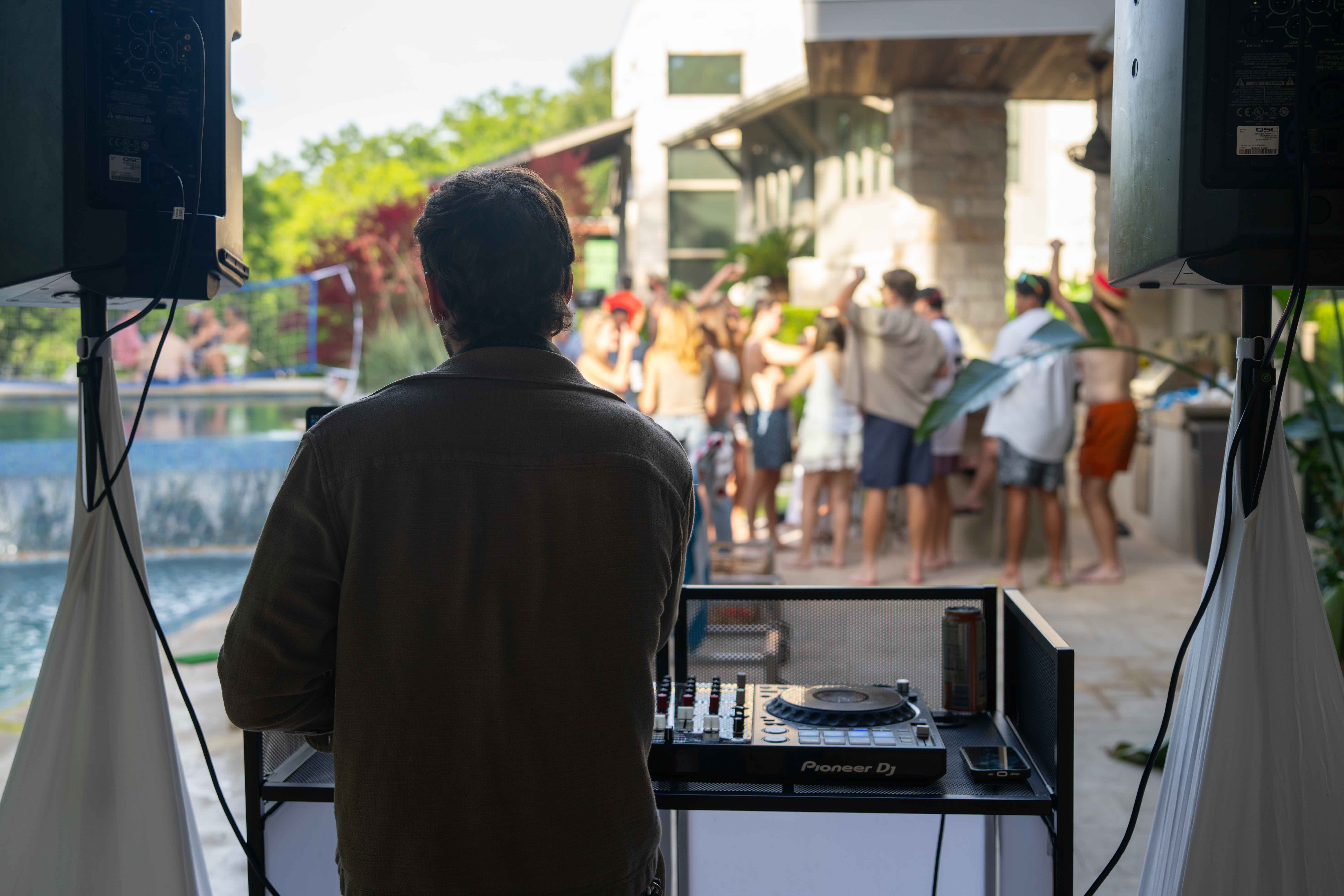 Good Life event — DJ and crowd poolside