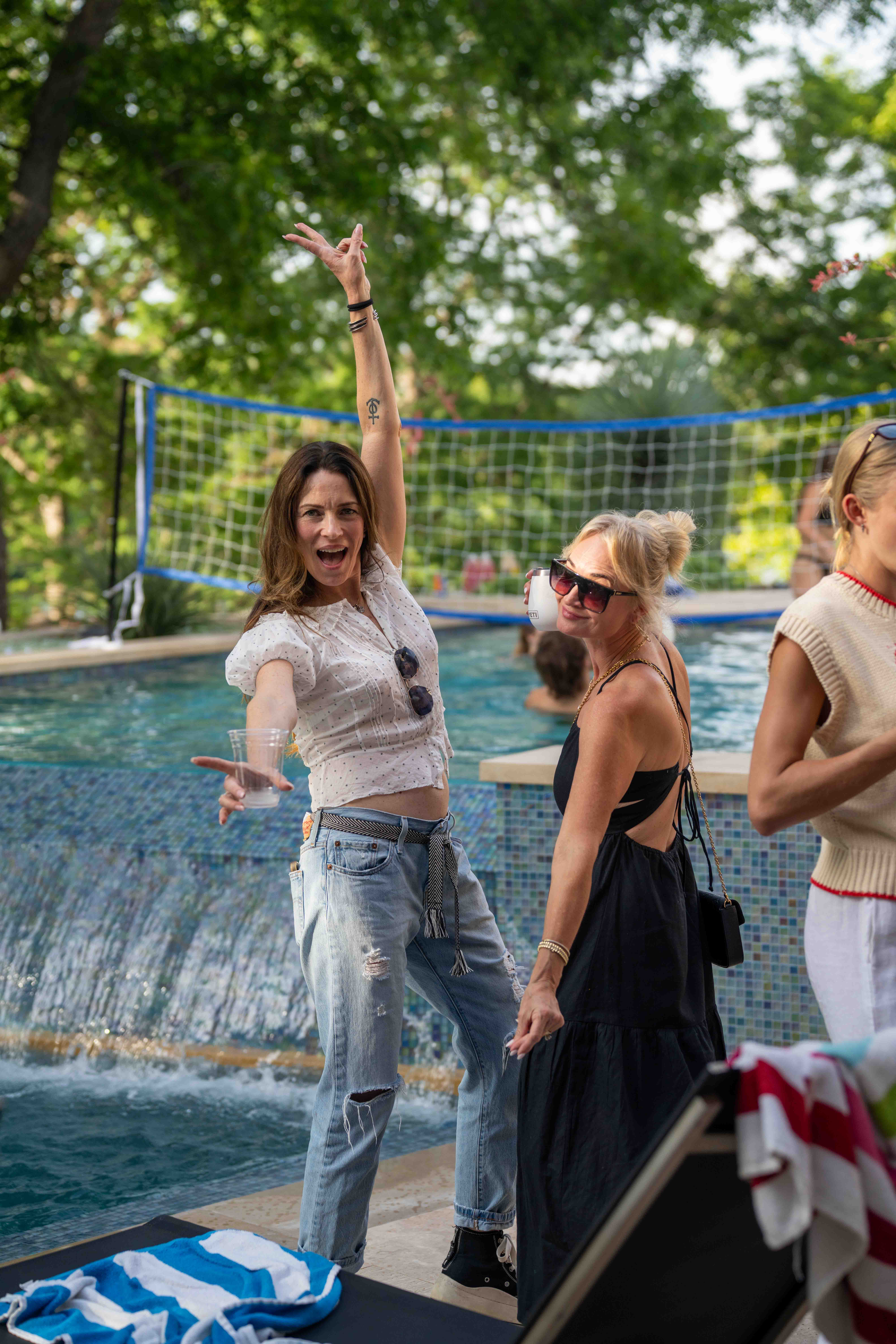 Guests dancing at an Austin poolside party